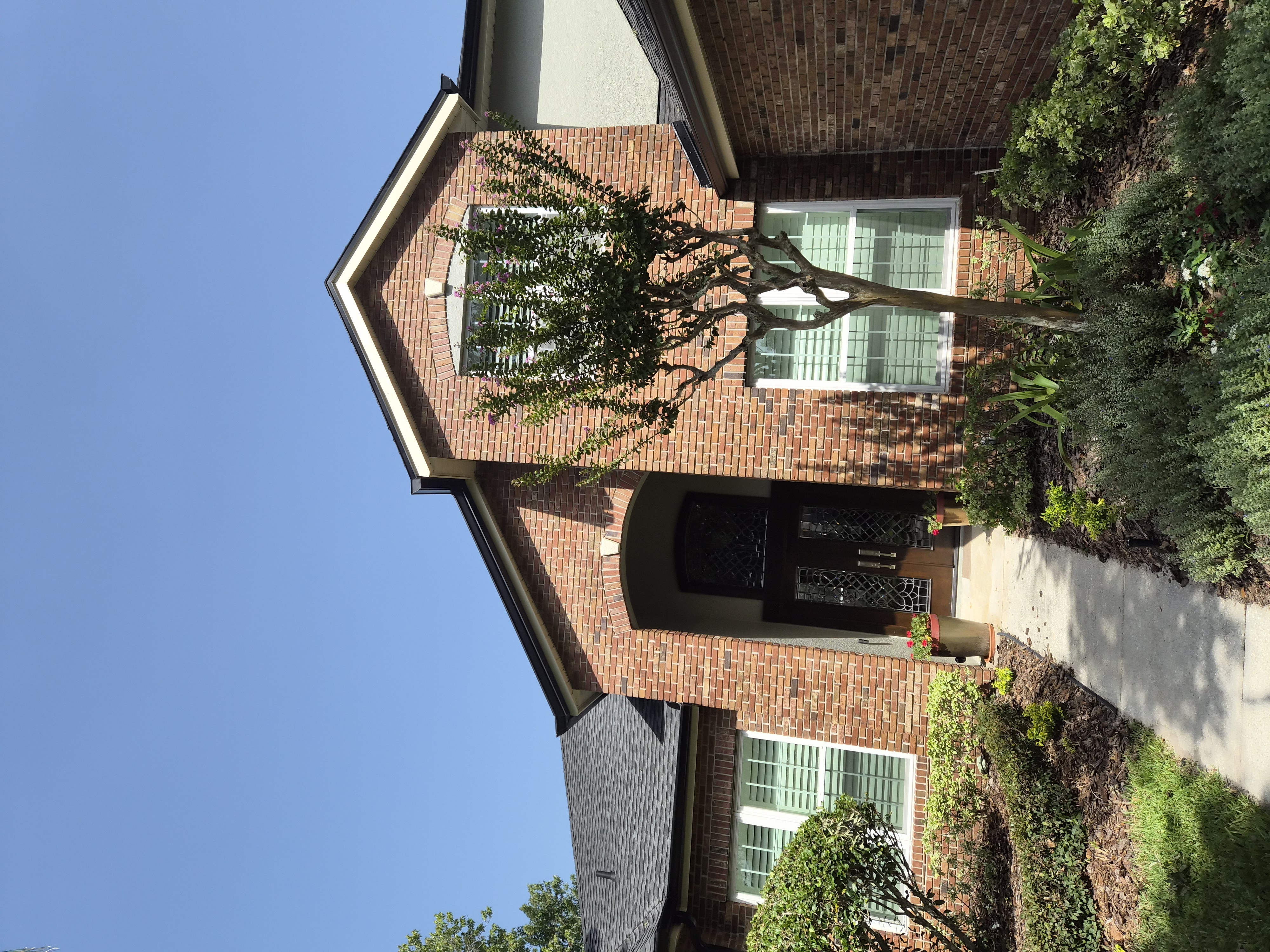 Brick home with seamless gutters installed by M12 Gutters in Florida